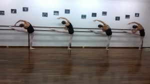 Advanced Foundation students of dance place melissia stretching after their ballet lesson.