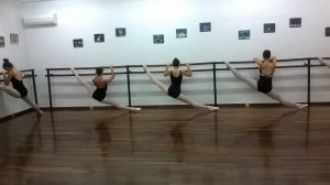 Advanced Foundation students of dance place melissia stretching after their ballet lesson.